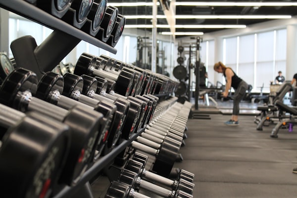 Person exercising with weights in a gym